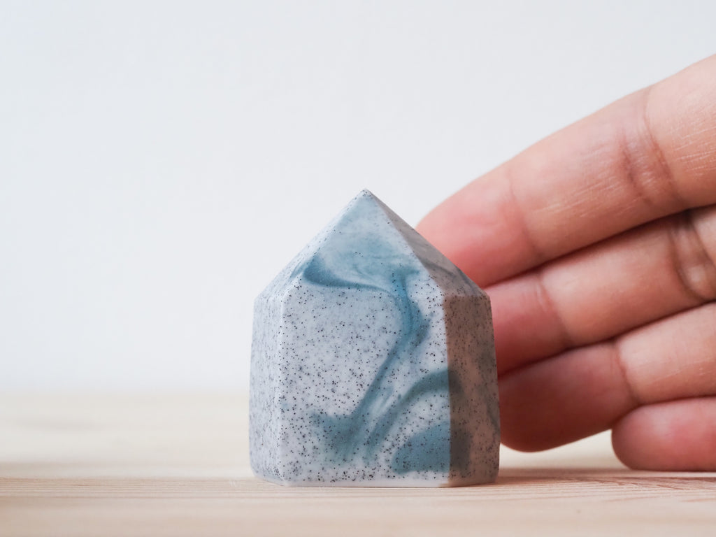 Handcrafted porcelain crystal sculpture, unique sculptural decorative piece with textured surface, subtle tints, and natural variations.