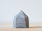 Handcrafted porcelain crystal sculpture, unique sculptural decorative piece with textured surface, subtle tints, and natural variations.