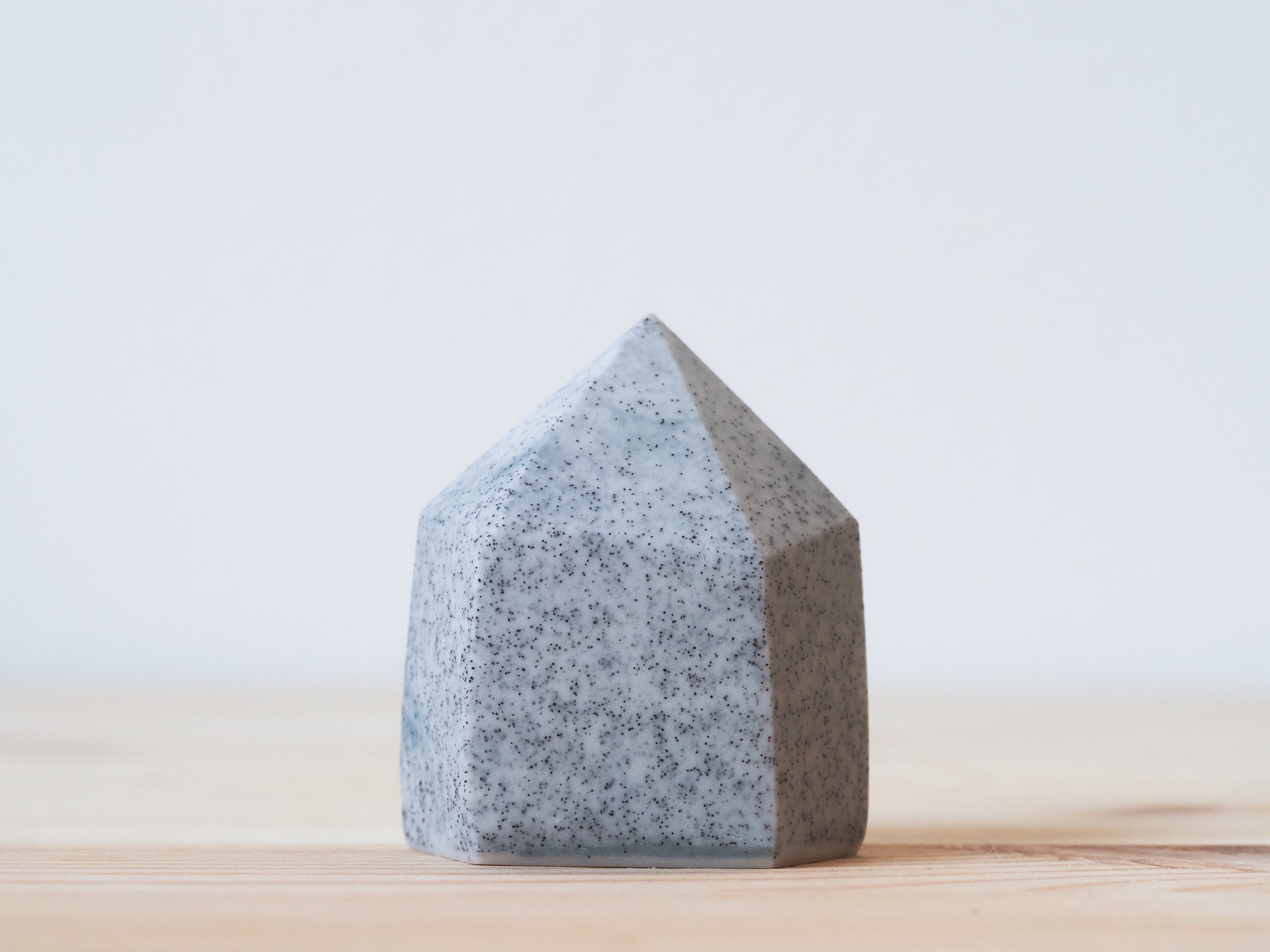 Handcrafted porcelain crystal sculpture, unique sculptural decorative piece with textured surface, subtle tints, and natural variations.
