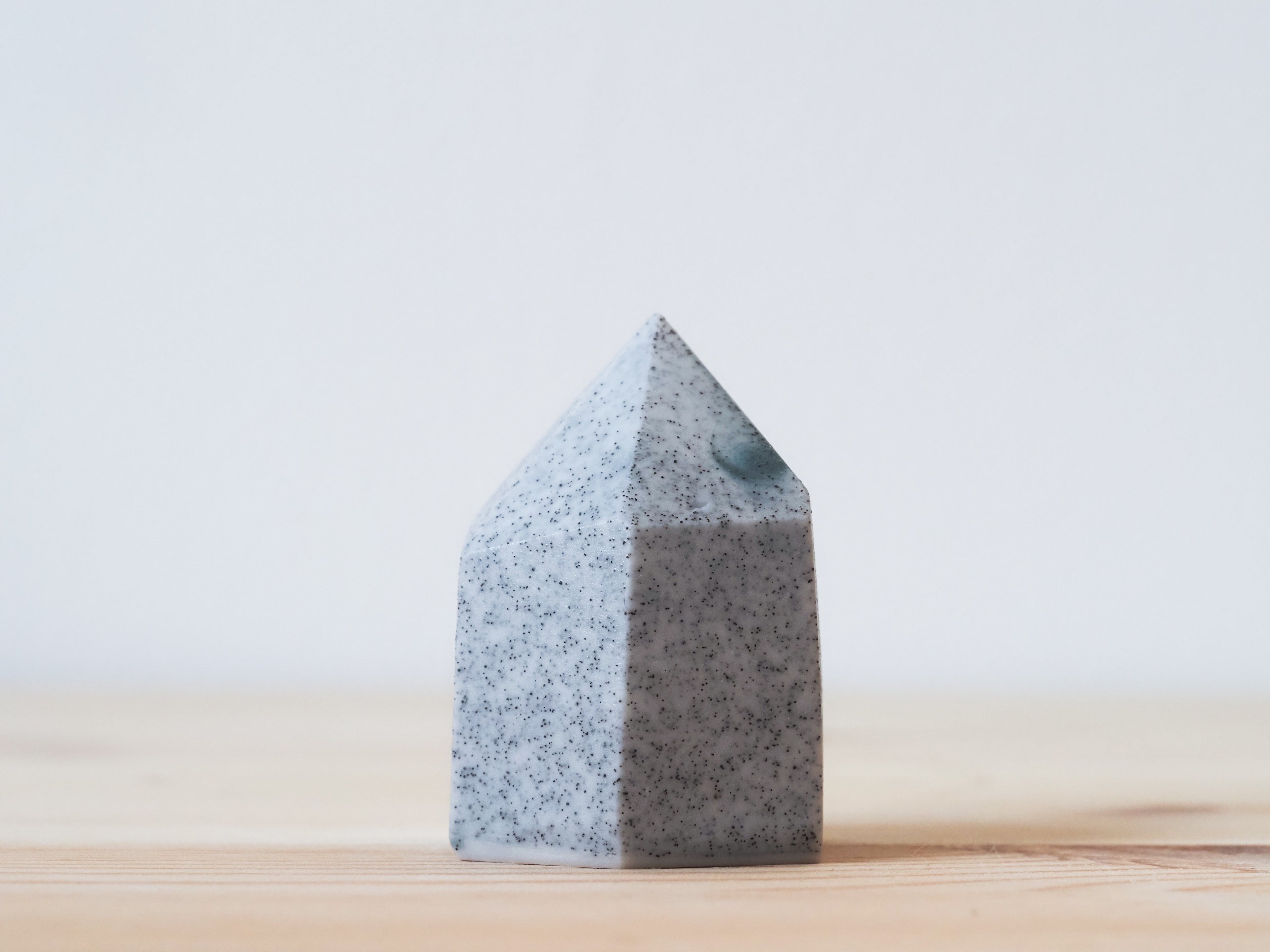 Handcrafted porcelain crystal sculpture, unique sculptural decorative piece with textured surface, subtle tints, and natural variations.