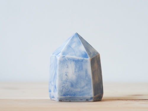 Handcrafted porcelain crystal sculpture, unique sculptural decorative piece with textured surface, subtle tints, and natural variations.