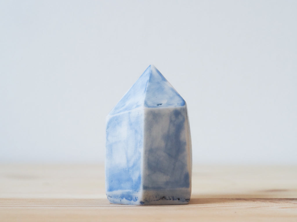 Handcrafted porcelain crystal sculpture, unique sculptural decorative piece with textured surface, subtle tints, and natural variations.