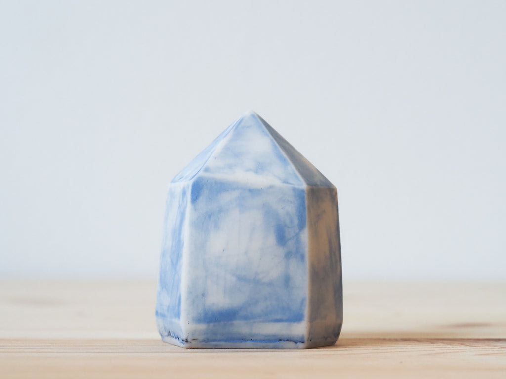 Handcrafted porcelain crystal sculpture, unique sculptural decorative piece with textured surface, subtle tints, and natural variations.