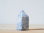Handcrafted porcelain crystal sculpture, unique sculptural decorative piece with textured surface, subtle tints, and natural variations.