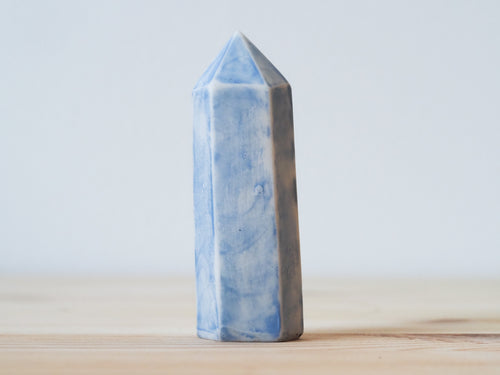 Handcrafted porcelain crystal sculpture, unique sculptural decorative piece with textured surface, subtle tints, and natural variations.