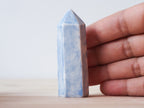 Handcrafted porcelain crystal sculpture, unique sculptural decorative piece with textured surface, subtle tints, and natural variations.