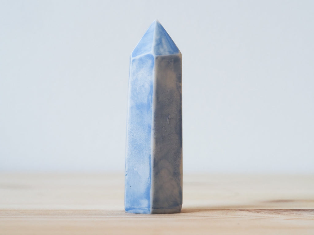 Handcrafted porcelain crystal sculpture, unique sculptural decorative piece with textured surface, subtle tints, and natural variations.