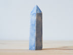 Handcrafted porcelain crystal sculpture, unique sculptural decorative piece with textured surface, subtle tints, and natural variations.