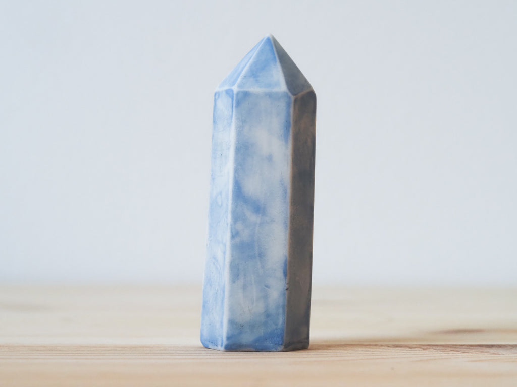 Handcrafted porcelain crystal sculpture, unique sculptural decorative piece with textured surface, subtle tints, and natural variations.