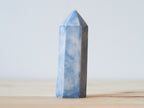 Handcrafted porcelain crystal sculpture, unique sculptural decorative piece with textured surface, subtle tints, and natural variations.