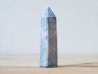 Handcrafted porcelain crystal sculpture, unique sculptural decorative piece with textured surface, subtle tints, and natural variations.