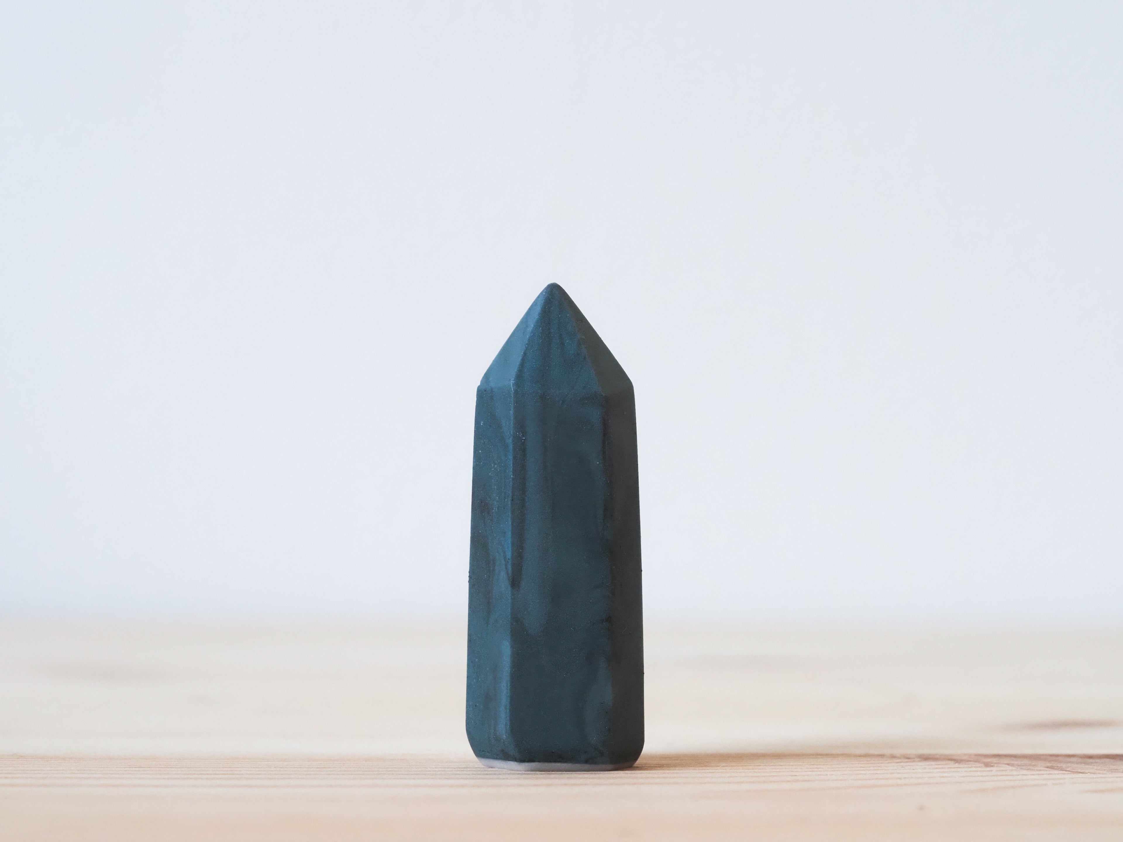 Handcrafted porcelain crystal sculpture, unique sculptural decorative piece with textured surface, subtle tints, and natural variations.