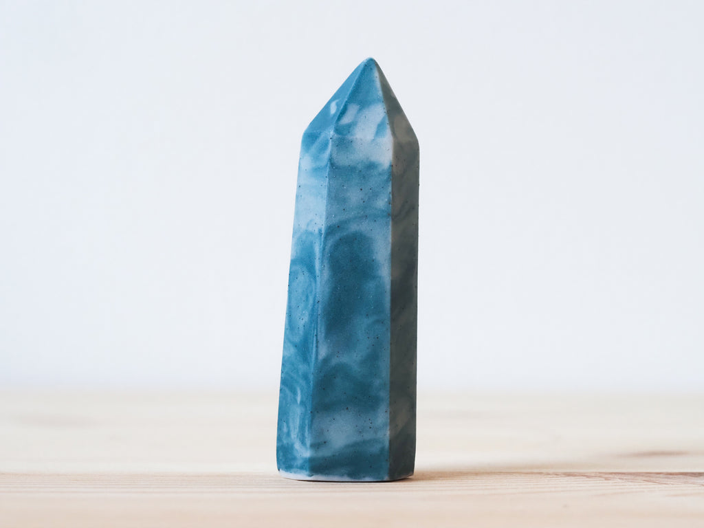 Handcrafted porcelain crystal sculpture, unique sculptural decorative piece with textured surface, subtle tints, and natural variations.