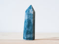 Handcrafted porcelain crystal sculpture, unique sculptural decorative piece with textured surface, subtle tints, and natural variations.