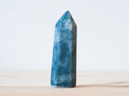 Handcrafted porcelain crystal sculpture, unique sculptural decorative piece with textured surface, subtle tints, and natural variations.