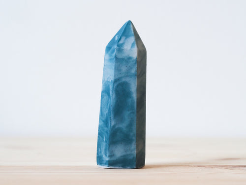 Handcrafted porcelain crystal sculpture, unique sculptural decorative piece with textured surface, subtle tints, and natural variations.