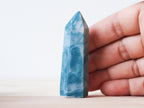 Handcrafted porcelain crystal sculpture, unique sculptural decorative piece with textured surface, subtle tints, and natural variations.