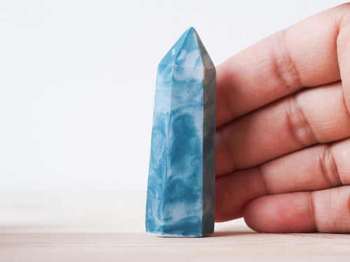 Handcrafted porcelain crystal sculpture, unique sculptural decorative piece with textured surface, subtle tints, and natural variations.