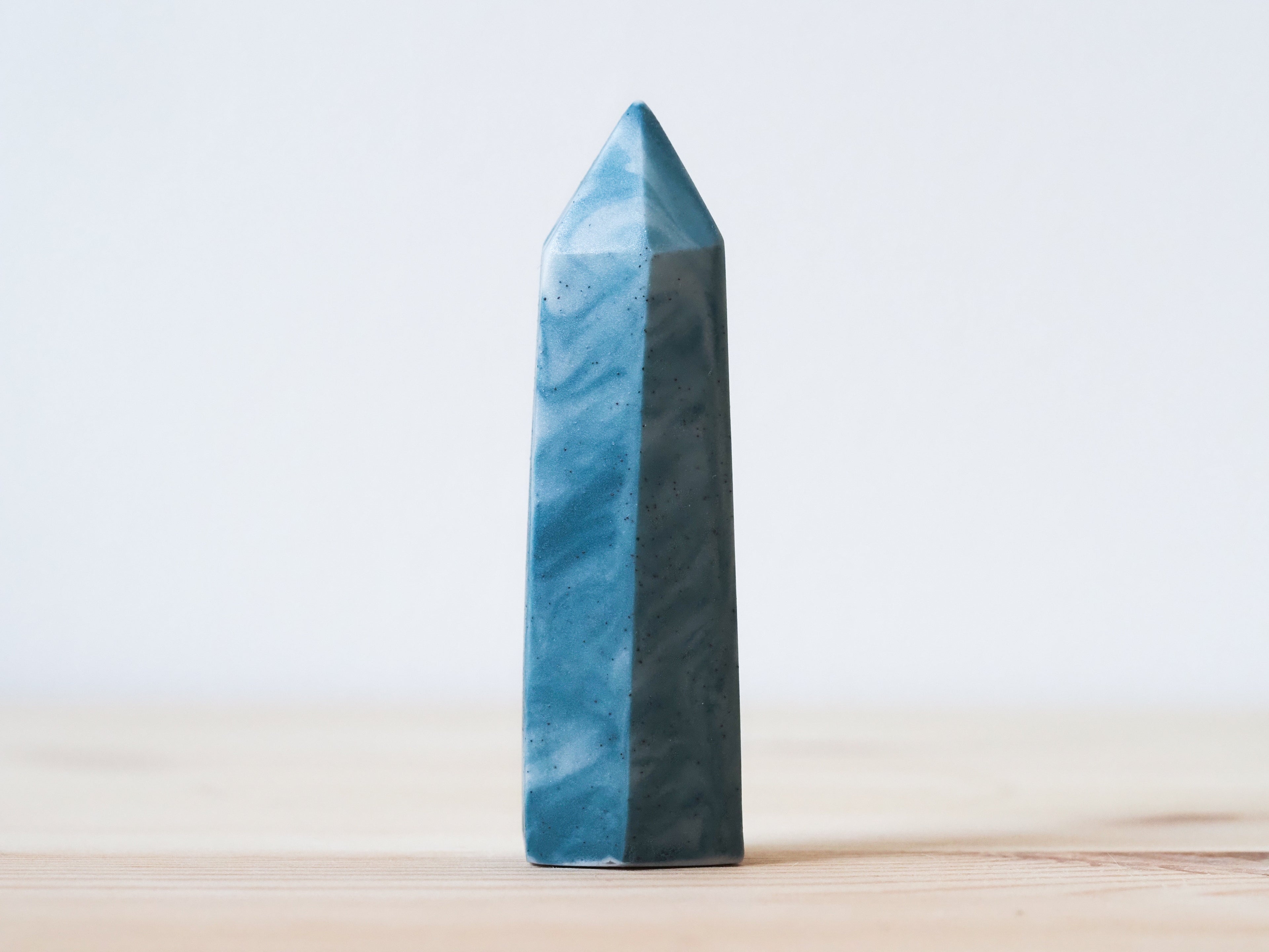 Handcrafted porcelain crystal sculpture, unique sculptural decorative piece with textured surface, subtle tints, and natural variations.