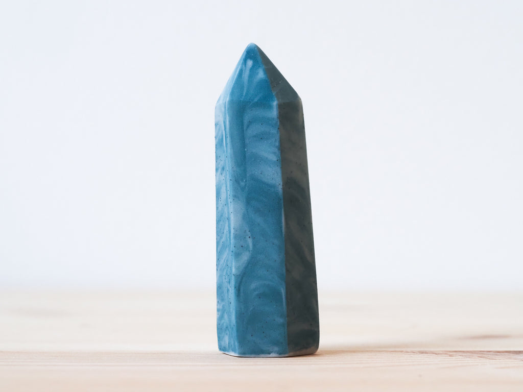 Handcrafted porcelain crystal sculpture, unique sculptural decorative piece with textured surface, subtle tints, and natural variations.