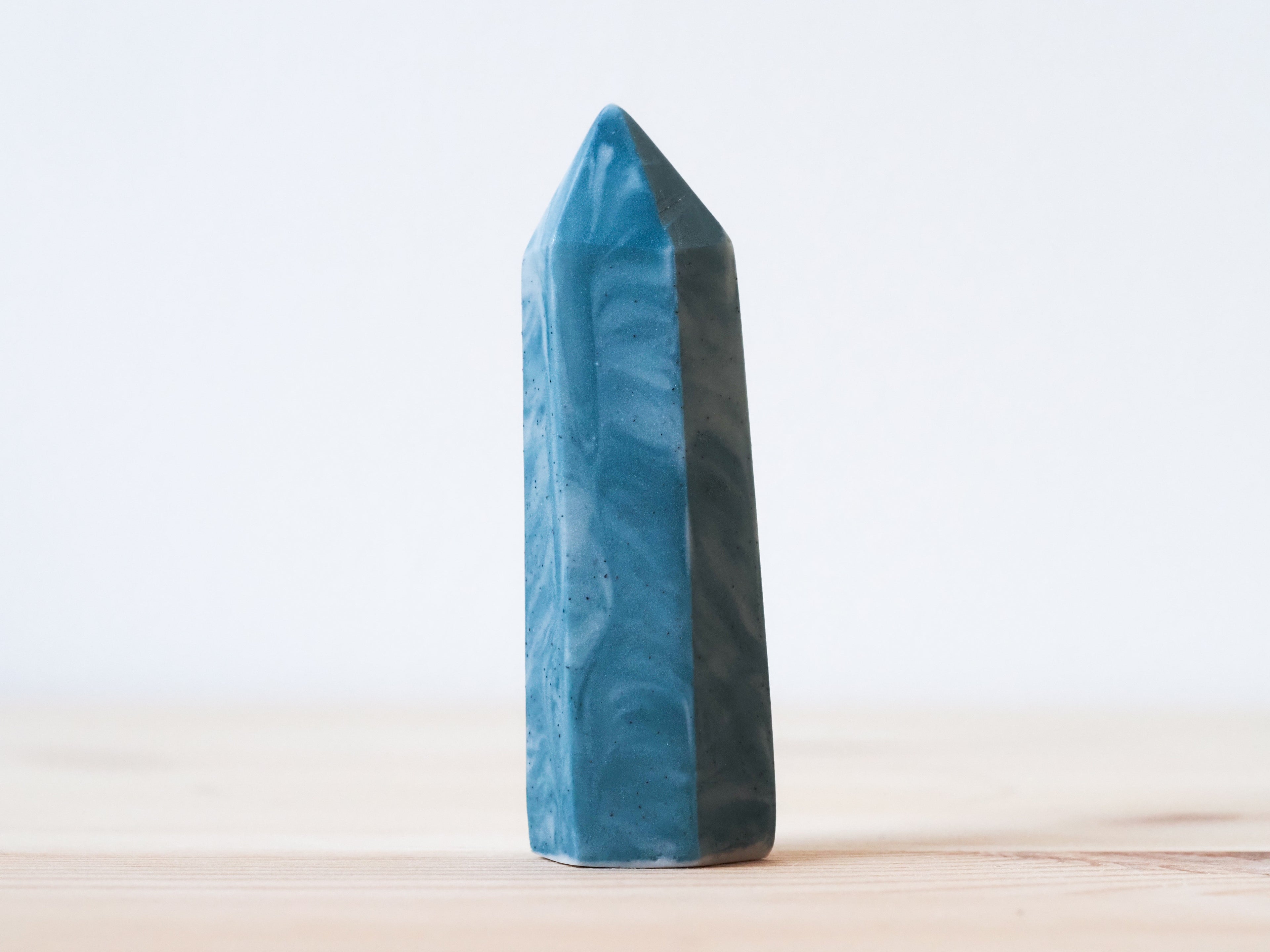 Handcrafted porcelain crystal sculpture, unique sculptural decorative piece with textured surface, subtle tints, and natural variations.