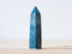 Handcrafted porcelain crystal sculpture, unique sculptural decorative piece with textured surface, subtle tints, and natural variations.