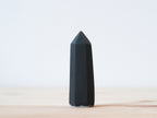 Handcrafted porcelain crystal sculpture, unique sculptural decorative piece with textured surface, subtle tints, and natural variations.