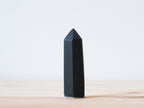 Handcrafted porcelain crystal sculpture, unique sculptural decorative piece with textured surface, subtle tints, and natural variations.