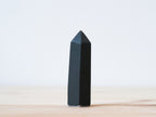 Handcrafted porcelain crystal sculpture, unique sculptural decorative piece with textured surface, subtle tints, and natural variations.