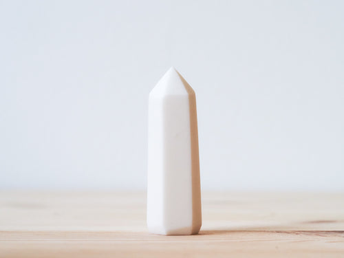 Handcrafted porcelain crystal sculpture, unique sculptural decorative piece with textured surface, subtle tints, and natural variations.