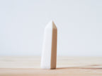 Handcrafted porcelain crystal sculpture, unique sculptural decorative piece with textured surface, subtle tints, and natural variations.