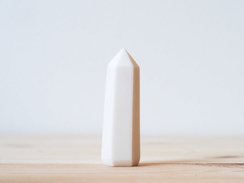 Handcrafted porcelain crystal sculpture, unique sculptural decorative piece with textured surface, subtle tints, and natural variations.