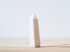 Handcrafted porcelain crystal sculpture, unique sculptural decorative piece with textured surface, subtle tints, and natural variations.