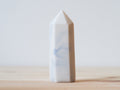 Handcrafted porcelain crystal sculpture, unique sculptural decorative piece with textured surface, subtle tints, and natural variations.