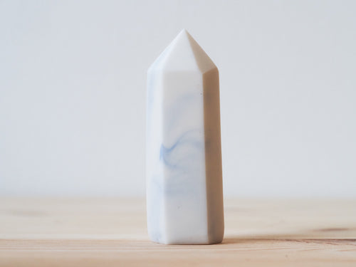 Handcrafted porcelain crystal sculpture, unique sculptural decorative piece with textured surface, subtle tints, and natural variations.