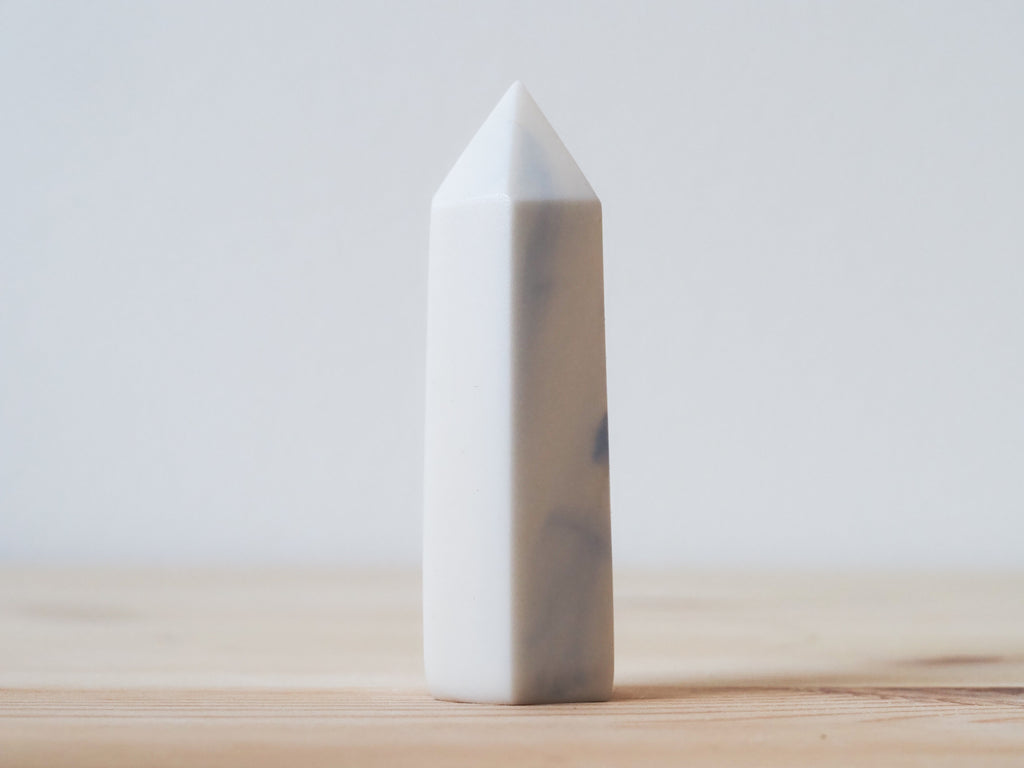 Handcrafted porcelain crystal sculpture, unique sculptural decorative piece with textured surface, subtle tints, and natural variations.