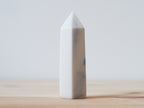 Handcrafted porcelain crystal sculpture, unique sculptural decorative piece with textured surface, subtle tints, and natural variations.