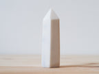 Handcrafted porcelain crystal sculpture, unique sculptural decorative piece with textured surface, subtle tints, and natural variations.