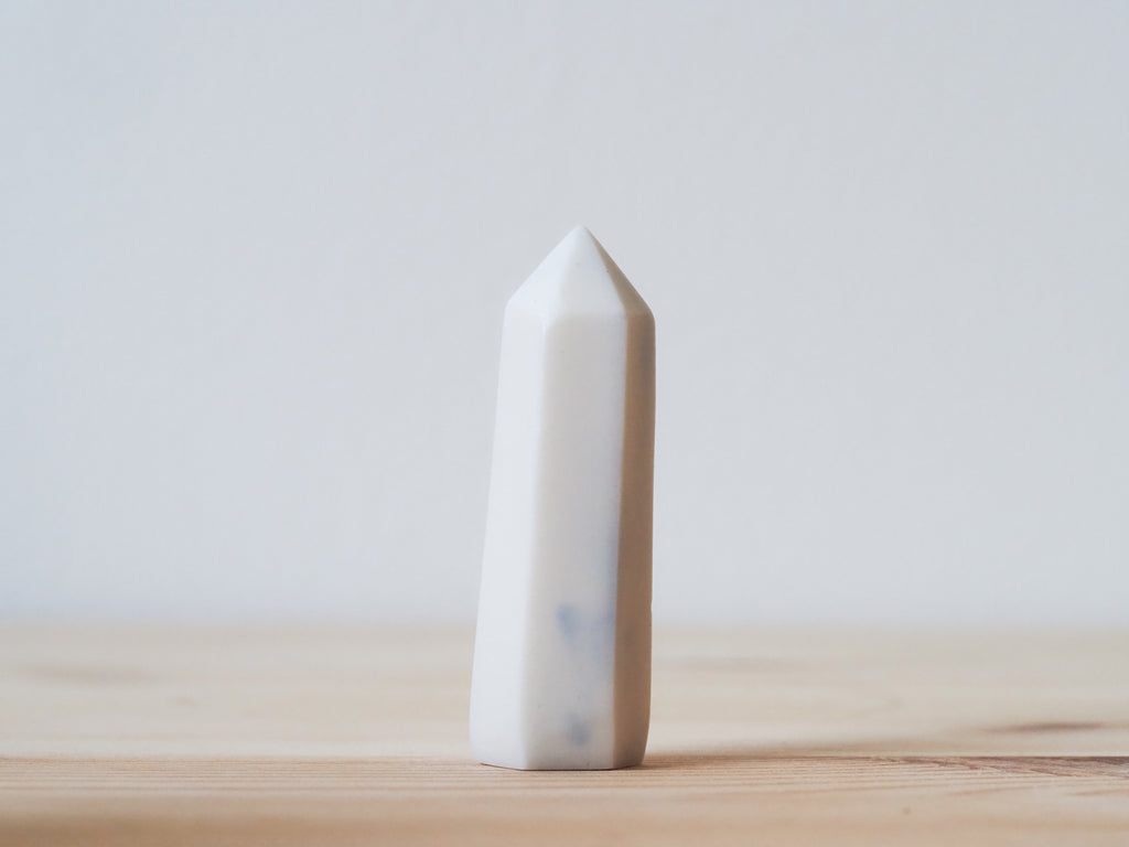 Handcrafted porcelain crystal sculpture, unique sculptural decorative piece with textured surface, subtle tints, and natural variations.