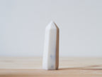 Handcrafted porcelain crystal sculpture, unique sculptural decorative piece with textured surface, subtle tints, and natural variations.