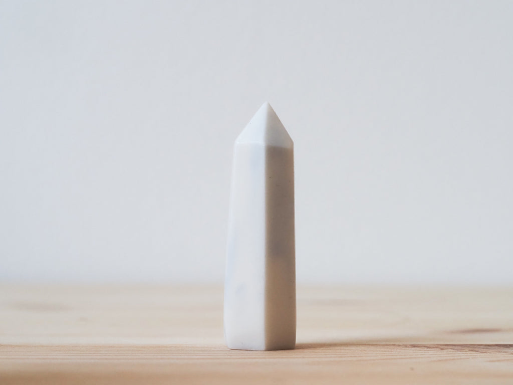 Handcrafted porcelain crystal sculpture, unique sculptural decorative piece with textured surface, subtle tints, and natural variations.