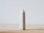 Handcrafted porcelain crystal sculpture, unique sculptural decorative piece with textured surface, subtle tints, and natural variations.