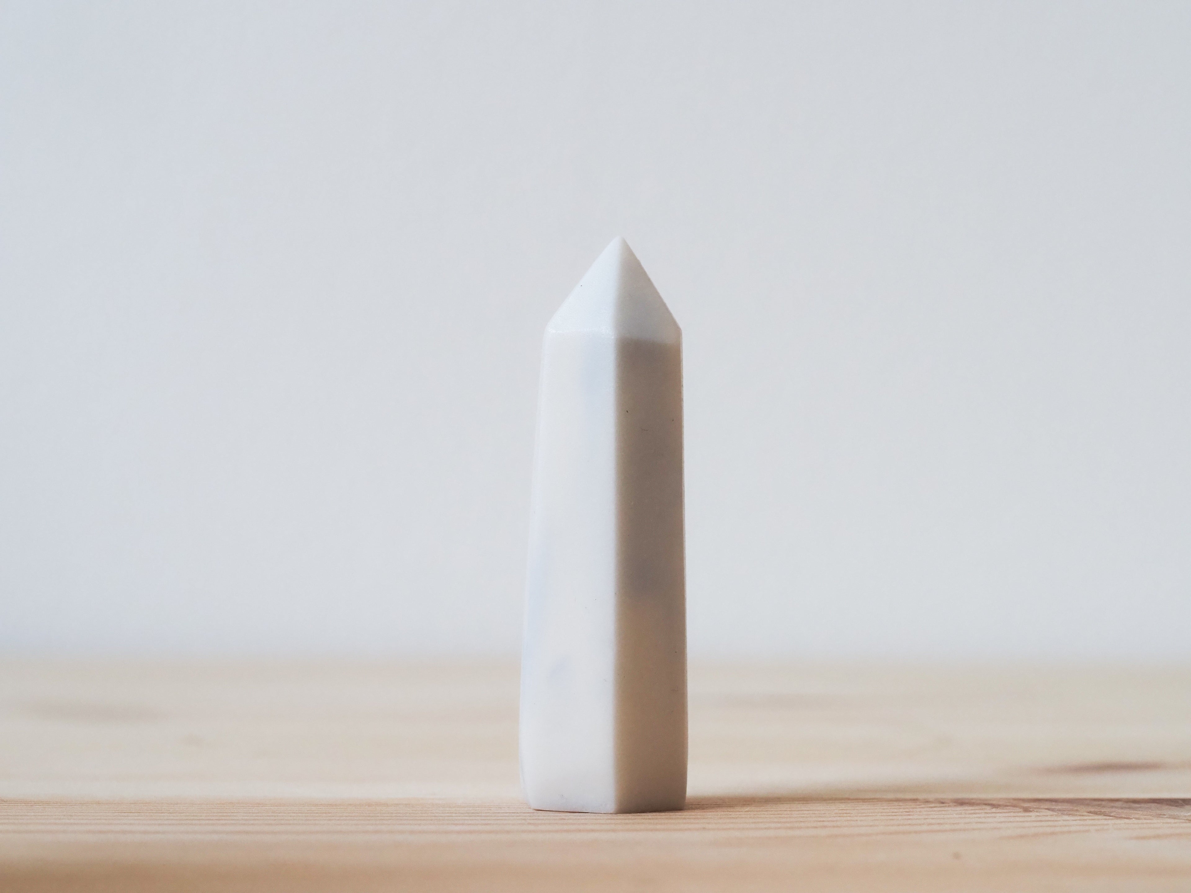 Handcrafted porcelain crystal sculpture, unique sculptural decorative piece with textured surface, subtle tints, and natural variations.