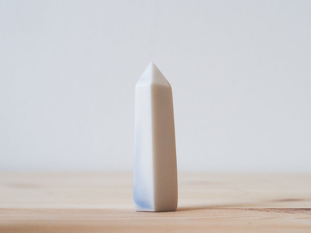 Handcrafted porcelain crystal sculpture, unique sculptural decorative piece with textured surface, subtle tints, and natural variations.