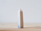 Handcrafted porcelain crystal sculpture, unique sculptural decorative piece with textured surface, subtle tints, and natural variations.